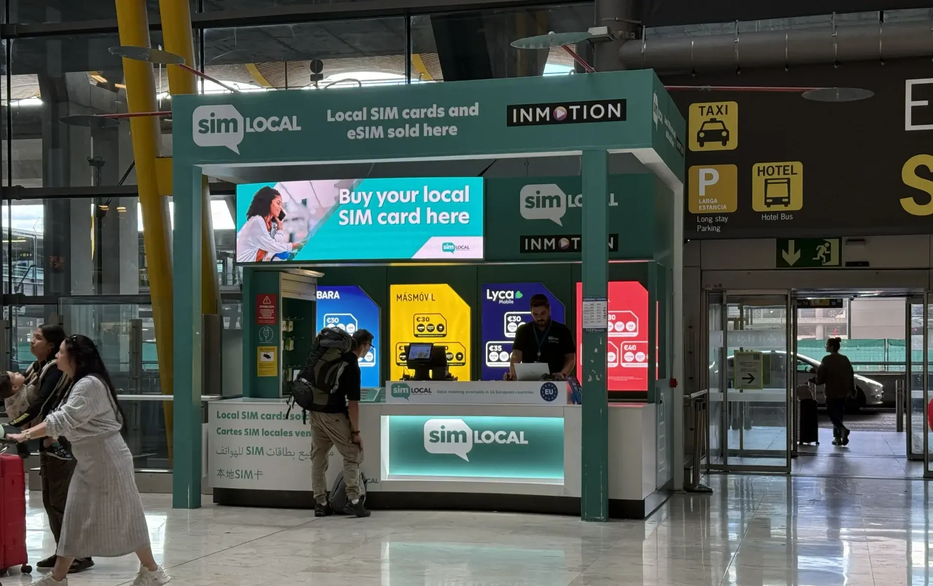 SIM Local store at Madrid Barajas Airport Terminal 4 arrivals, where travelers can buy local prepaid SIM cards from providers such as Lycamobile, MasMovil and LEBARA